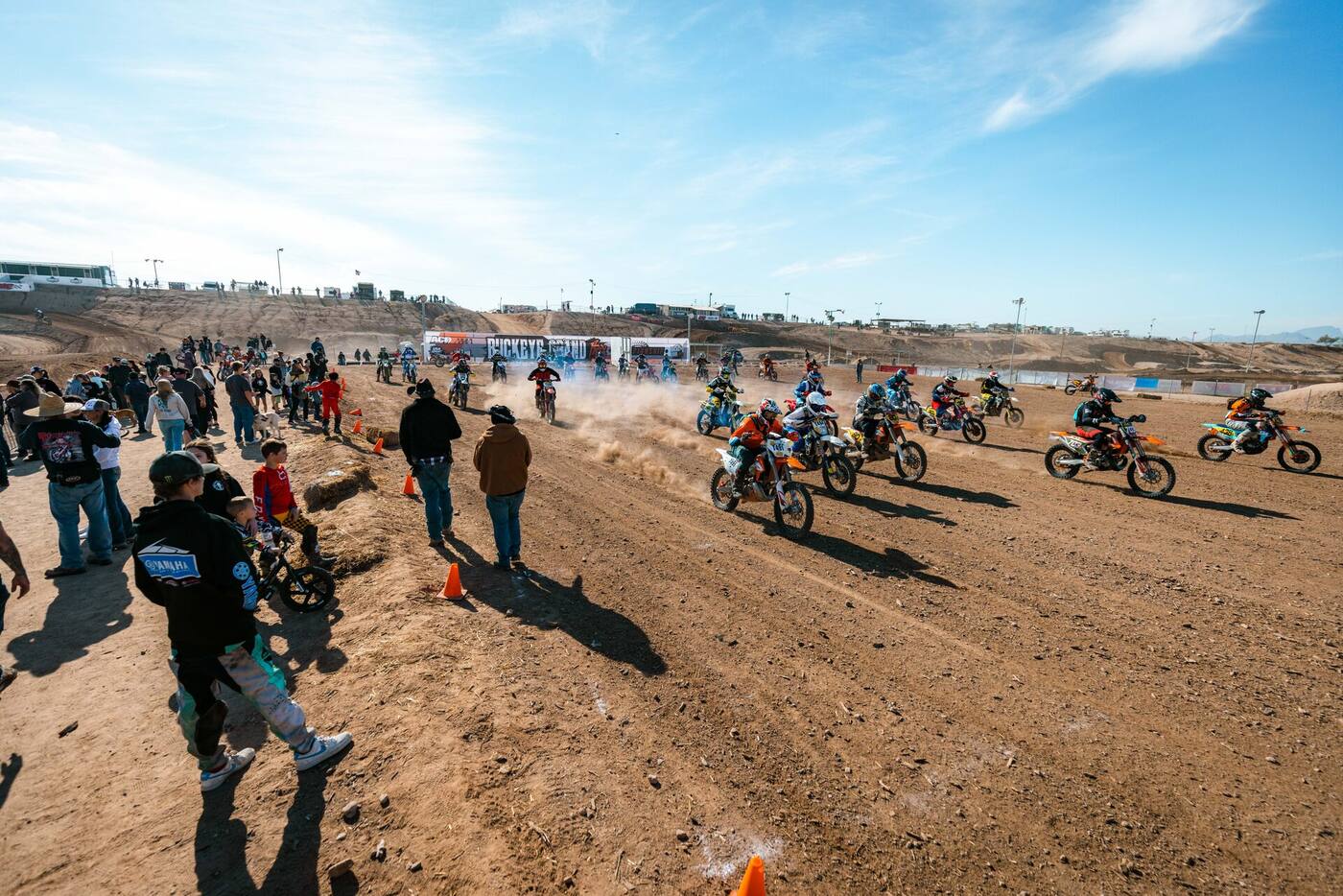 A large field of racers accelerating from the Buckeye Grand Prix start