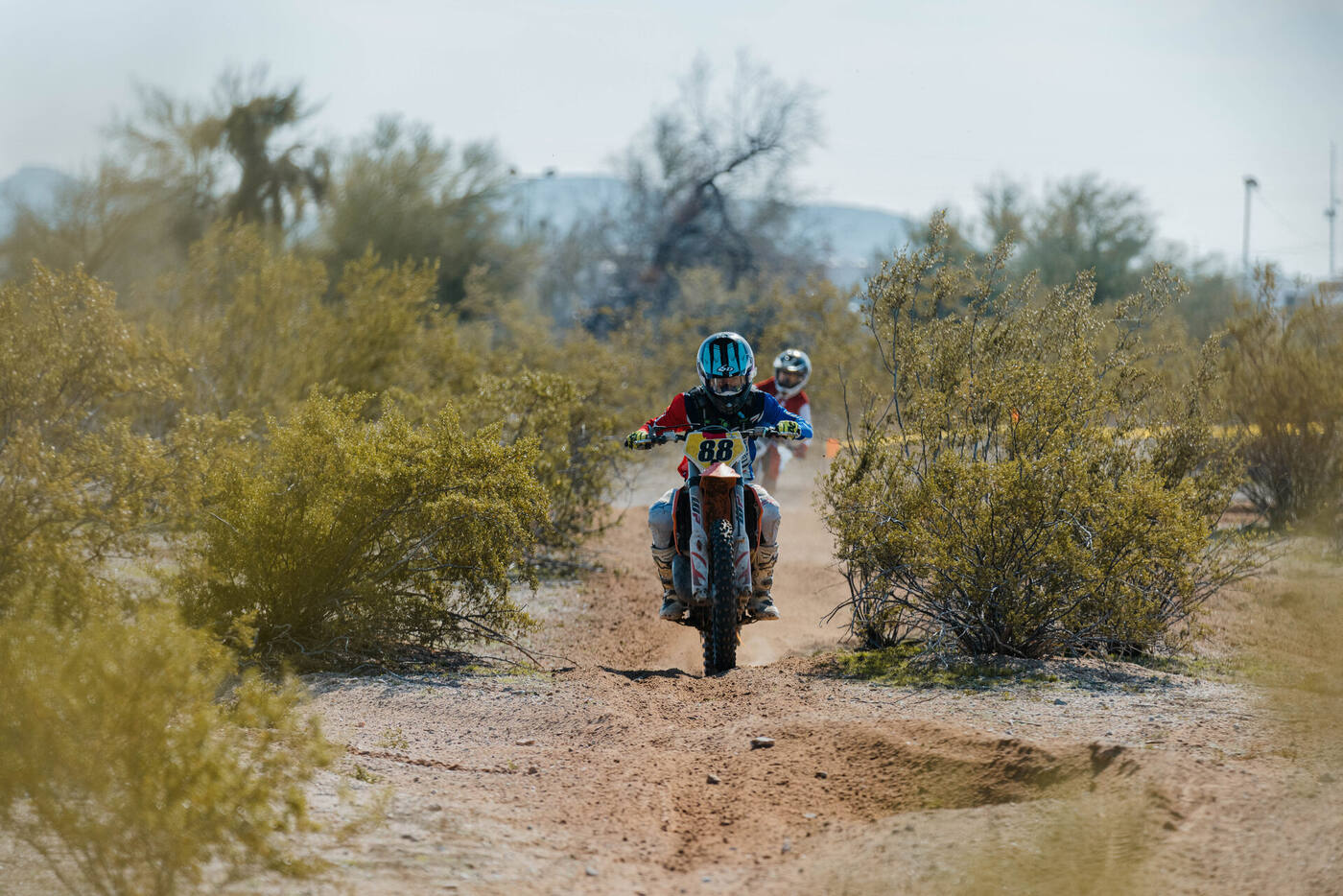 Youth racers navigating the desert trail at the Buckeye Grand Prix